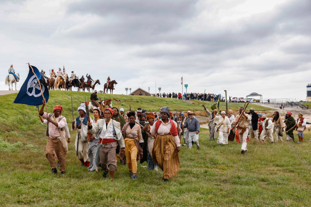 Documentation of Slave Rebellion Reenactment, a community engaged performance initiated by Dread Scott. Performend November 8-9, 2019 in the outskirts of New Orelans. Photographed by Soul Brother